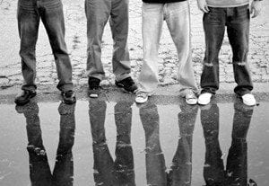 Men standing in water